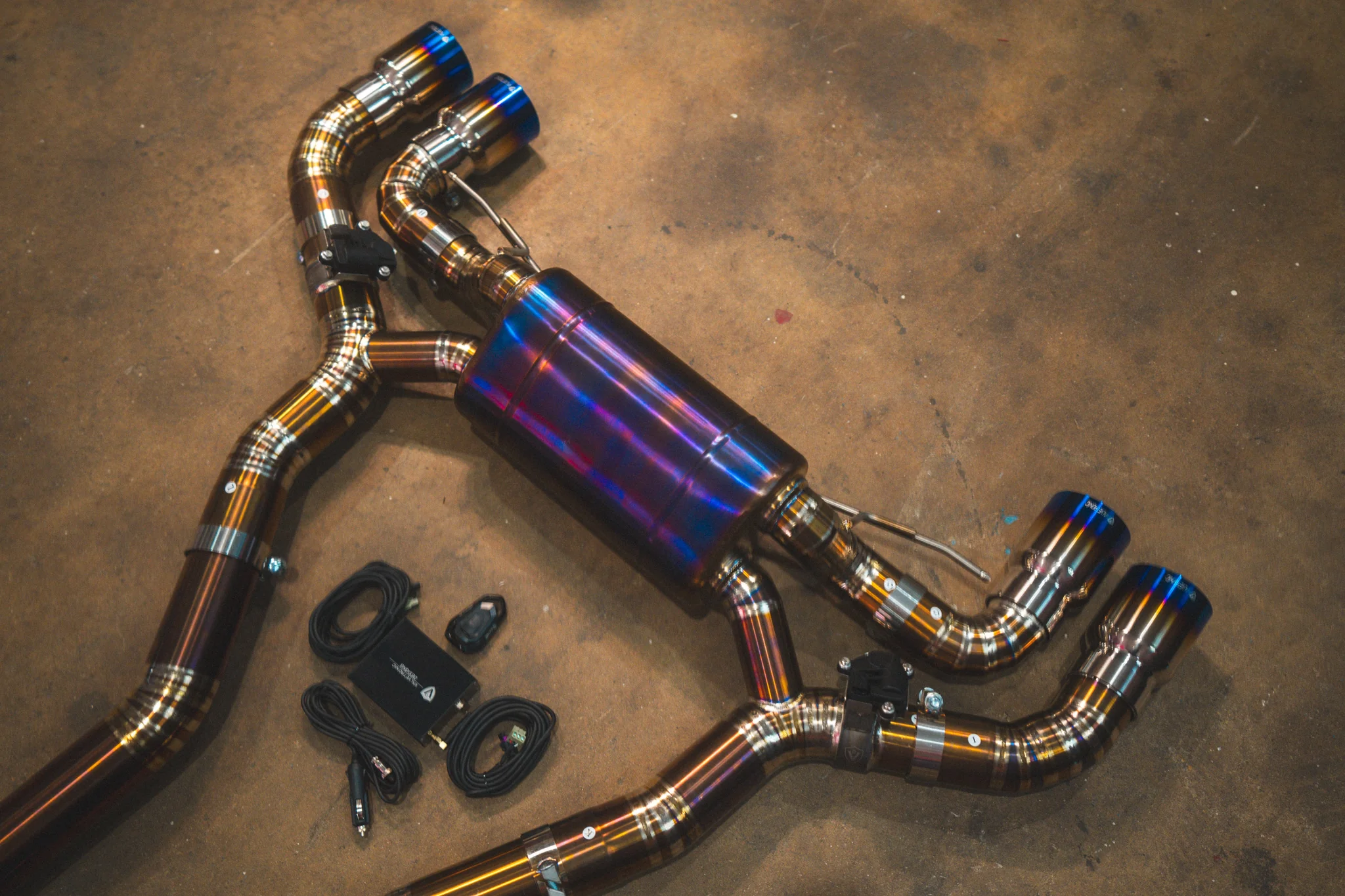 Color-finished performance exhaust system with valved piping prepared for installation