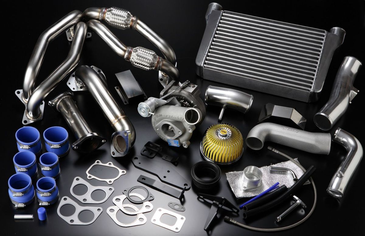 Complete aftermarket turbocharger, intercooler, header and piping kit arranged for installation