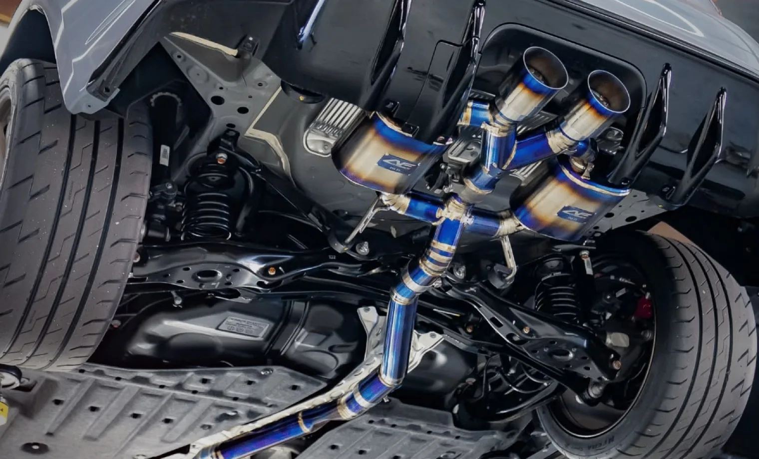 Performance exhaust system installed beneath a vehicle