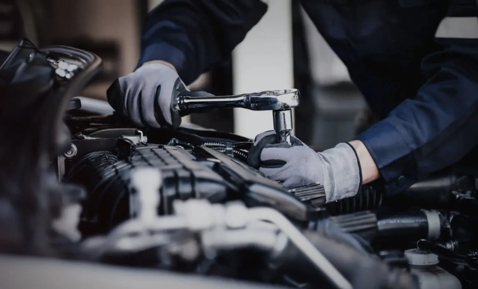 Automotive technician completing a general engine-bay repair